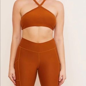 Wolven Tumeric Pyramid bra + Biker short set. Made from 10 recycled bottles